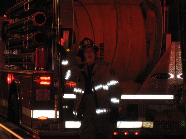 Past Chief Lonnie Brown chauffeuring Engine 21-2 on a fire in town.